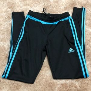 Black Adidas soccer pants with blue stripes
